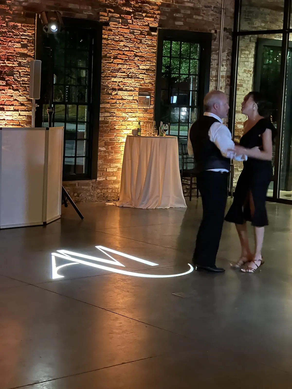 Custom monogram projected onto a dance floor